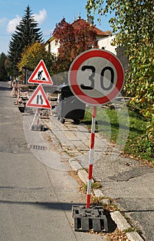 Roadwork and slowdown sign