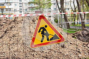 Roadworks, under construction. Earthwork sign on fence