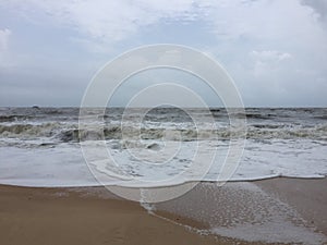 Roaring and foamy sea waves at Kundapura beach