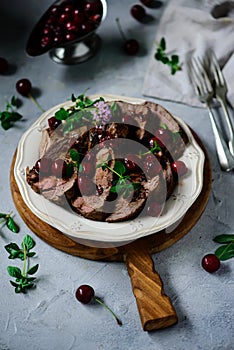 Roast beef with cherry sauce.style rustic