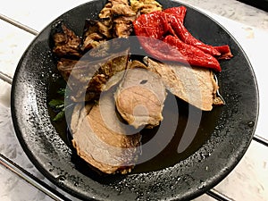 Roast Beef with Fried Vegetables in Black Plate