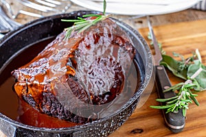 Roast beef with gravy and meat fork