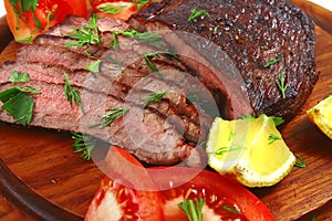 Roast beef meat slices on plate photo