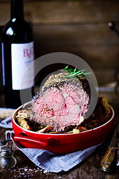 Roast beef rib eye with  garlic and rosemary.style rustic