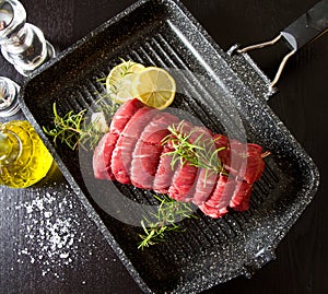 Roast of beef with rosemary on plate pot
