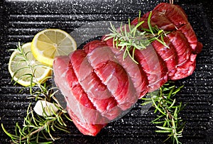 Roast of beef with rosemary on plate pot