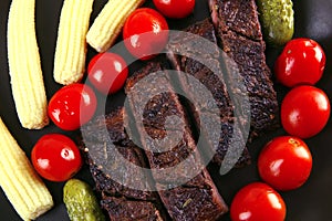 Roast beef with tomatoes and corns