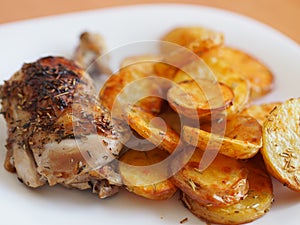 Roast chicken with baked potatoes