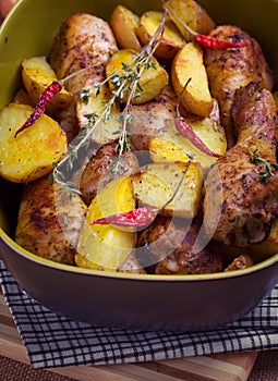 Roast chicken legs with potatoes