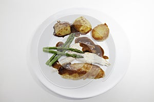 Roast chicken meal with organic asparagus, potatoes and gravy