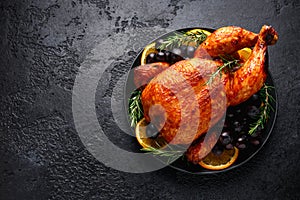 Roast Chicken in oven with on black rustic table