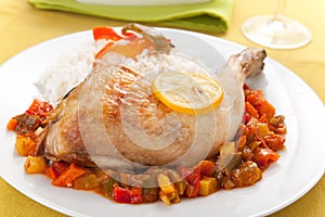Roast chicken with red and green peppers photo