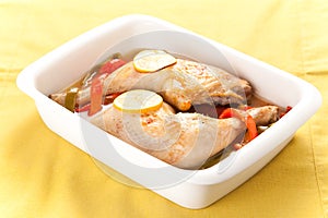 Roast chicken with red and green peppers photo