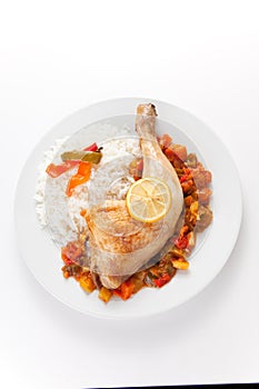 Roast chicken with red and green peppers photo