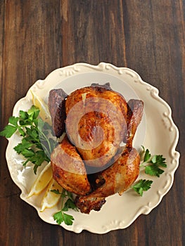 Roast chicken seasoned with herbs and lemon