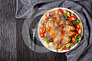 Roast chicken served with vegetables on a platter