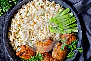 Roast chicken thighs with pasta in a skillet