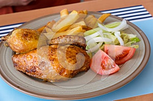 Roast chicken with vegetables dinner plate