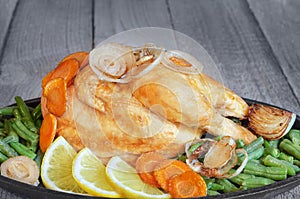 Roast chicken with vegetables in a pan