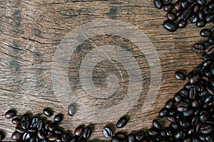Roast coffee bean on wooden table frame with copy space