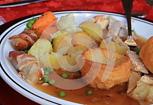 Roast dinner with Yorkshire pud and sausages photo