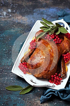 Roast duck with oranges, sage and berries