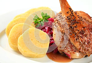 Roast duck with potato dumplings and red cabbage