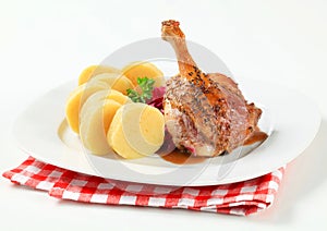 Roast duck with potato dumplings and red cabbage