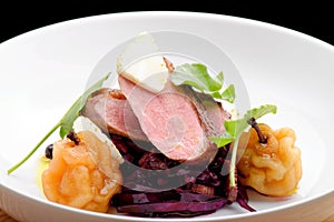 Roast duck, red cabbage and dry fruits