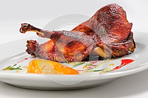 Roast half of duck with caramelized lemon