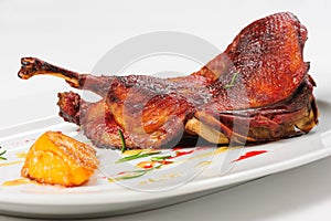 Roast half of duck with caramelized lemon