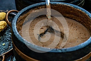 roast meat in a pot on the dinner table