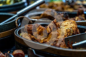 roast meat in a pot on the dinner table