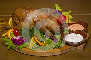 Roast partridge with fresh vegetables.