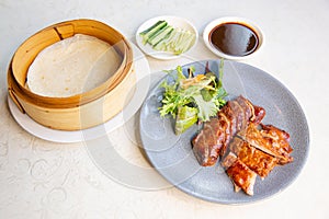Roast Peking duck set combo with roll roti bread of traditional Cantonese yum-cha Asian gourmet cuisine