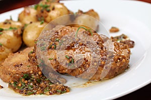 Roast pork with baby potatoes