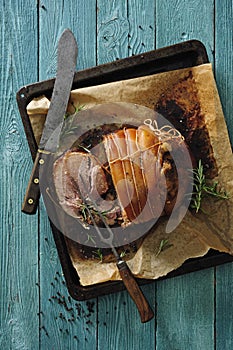 Roast pork ham with garlic and herbs.