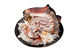 Roast Pork Ham Hock, knuckle with Sauerkraut on a plate. Isolated on white background. Top view.