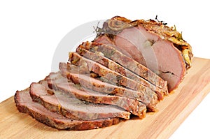 Roast pork on a wooden board