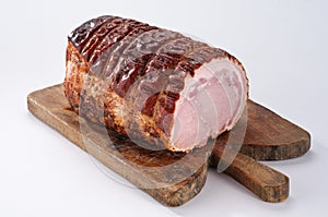 Roast pork on wooden board