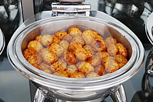 Roast potatoes in a chafing dish buffet