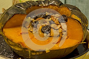 Roast pumpkin full with fresh and dry fruits, honey, walnuts