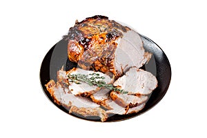 Roast rolled pork ham meat on plate with thyme. Isolated on white background.