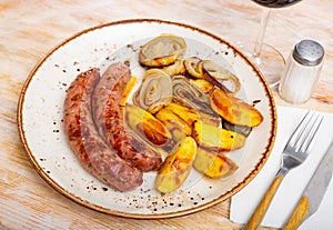 Roast sausages with potatoes