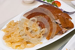 Roast suckling pig with jellyfish