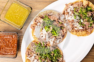 Roast tacos with corn tortillas. Mexican tacos. traditional mexican food concept on wooden table