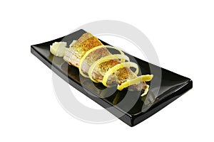Roast tuna with lemon on ceramic