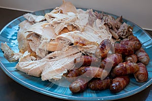 Roast turkey and pigs in blankets ready to be served for Christmas dinner