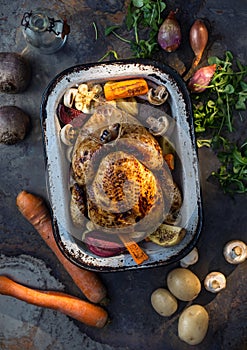 Roast whole turkey or chicken in old pan with vegetables