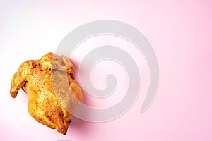 Roast whole turkey or chicken on pink background. Top view. Food pattern. Festive family dinner. Thanksgiving day concept